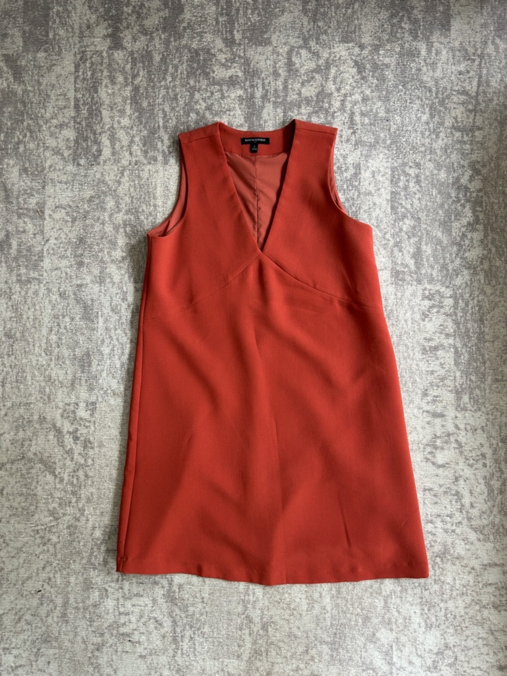 Banana Republic Sleeveless Rust color Sheath Dress. The dress is not red.